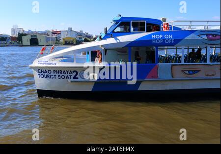 Bangkok, Thailand- January 28 2020: Closeup hop on hop off tourist boat docks at Phra Arthit pier on Chao Phraya river Stock Photo