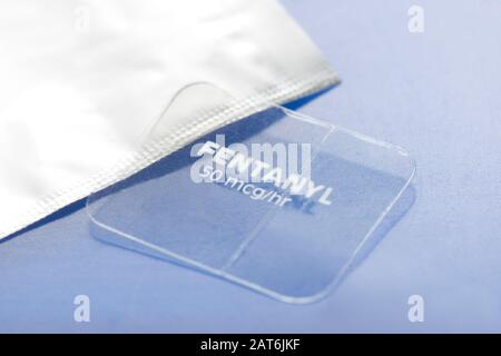 Fentanyl transdermal 50mcg/hr timed release skin patch and foil wrapper. Stock Photo