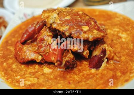 Singapore chilli crab street food a great reason to visit this Asian city experiencing the exotic far east, it's modern, with English speaking locals. Stock Photo