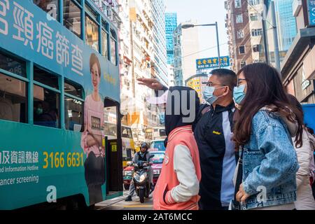 Hong Kong - January 30th, 2020: People  wearing surgical masks in the fear of Wuhan Coronavirus. Stock Photo