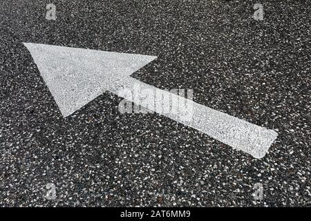directions painted on road surface Stock Photo