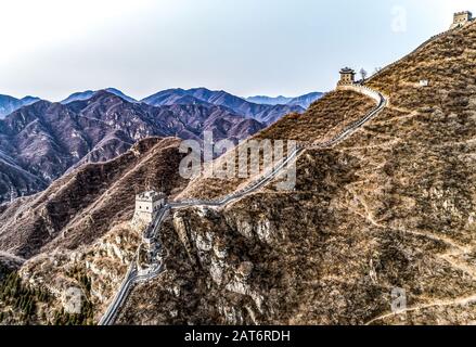 Beautiful winter aerial drone view of Great Wall of China Mutianyu section near Bejing. Stock Photo