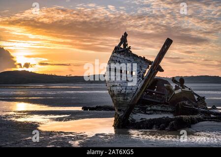 Old shipwreck called Bad Eddie.  This was taken at low tide at sunset in Donegal Ireland Stock Photo