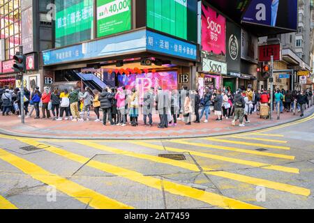 Hong Kong. 31st Jan, 2020. Hundreds of people queue to buy surgical masks at a Bonjour Cosmetics stores in Causeway Bay Hong Kong.  There is a shortage of face masks in the city and people often line up for hours in hopes of purchasing some at inflated prices. Stock Photo