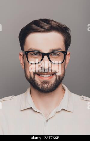 Portrait of happy smiling brainy young guy in spectacles Stock Photo