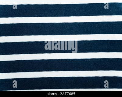 Texture of blue fabric with white stripes. Background image. Place for text. Stock Photo