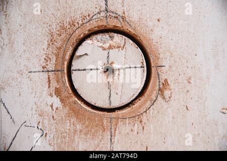Hole for electrical outlet, switch in concrete wall from round diamond cutter Stock Photo