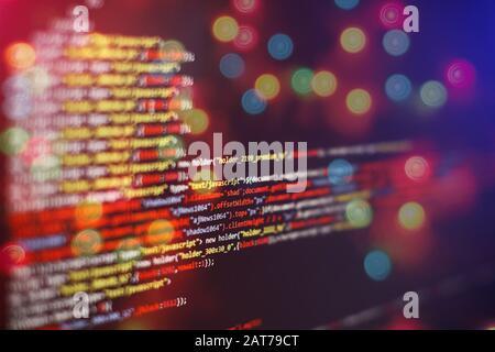 Coding script text on screen. Notebook closeup photo. CSS, JavaScript and HTML usage. Stock Photo