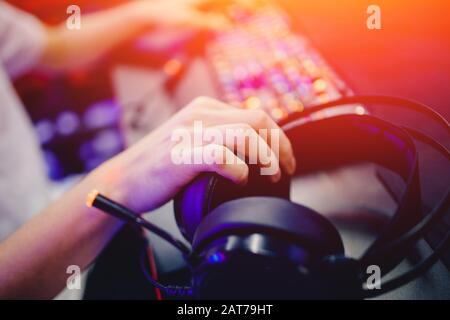 Headphone backlit for video gamer computer esports in internet cafe Stock Photo