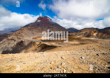 Scenic view on Mount Doom (Mount Ngauruhoe) surrounded by clouds from Red Crater in Tongariro Nation Park, New Zealand, North Island Stock Photo