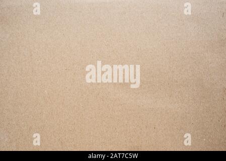 Brown corrugated cardboard box with grained tecture background. Concept of packaging and shipping Stock Photo