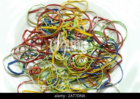 Elastic multicolored elastic bands lie on a table Stock Photo