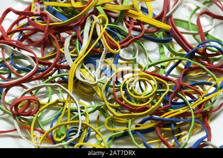 Elastic multicolored elastic bands lie on a table Stock Photo