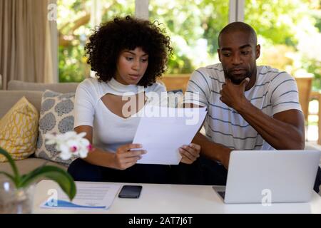 Young couple discussing on the sofa Stock Photo