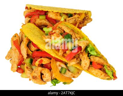 Fried chicken and vegetable filled tacos isolated on a white background Stock Photo