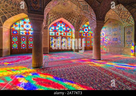 Nasir-ol-Molk Mosque, Light patterns from colored stained glass illuminating the iwan, Shiraz, Fars Province, Iran Stock Photo