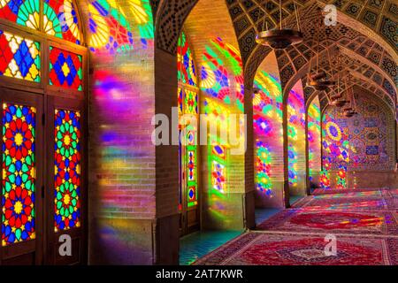 Nasir-ol-Molk Mosque, Light patterns from colored stained glass illuminating the iwan, Shiraz, Fars Province, Iran Stock Photo