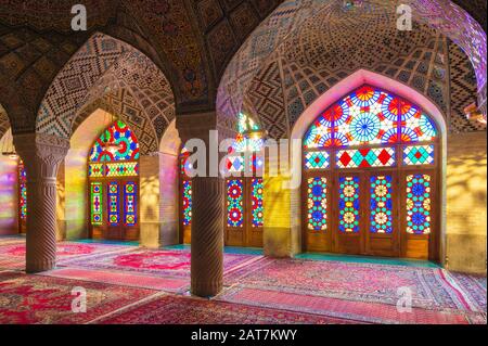 Nasir-ol-Molk Mosque, Light patterns from colored stained glass illuminating the iwan, Shiraz, Fars Province, Iran Stock Photo