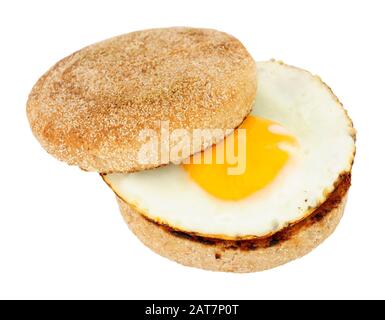 Fried egg on a soft toasted wholemeal English muffin isolated on a white background Stock Photo
