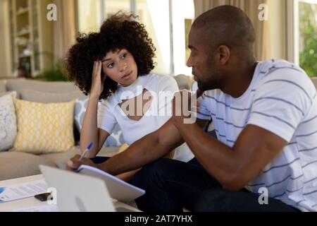 Young couple discussing on the sofa Stock Photo