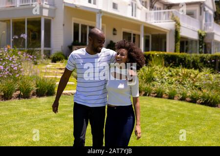 Happy young couple holding each other Stock Photo