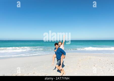 Young couple having fun at the beach Stock Photo