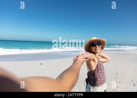 Young couple having fun at the beach Stock Photo