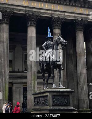 A cone covered with an EU flag on the Duke of Wellington statue in Glasgow, ahead of the UK leaving the European Union at 11pm on Friday. Stock Photo