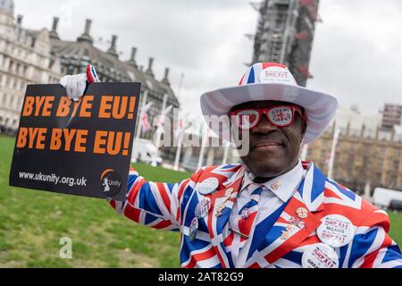 London, UK. 31 January 2020. Brexiter, Joseph Afrane dressed in a Union Jack suit at Parliament Square Stock Photo