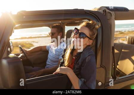 Couple in a car at the beach