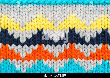 Handmade knitted multi-colored pattern. Hobby background Stock Photo