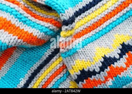 Colorful knit sweater background. Empty copy space background with saturated sweater. Hobby background Stock Photo
