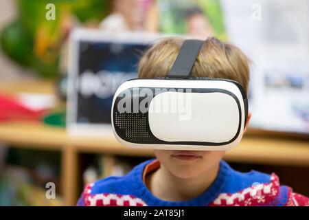 Child in virtual glasses. The boy in 3D glasses. Stock Photo
