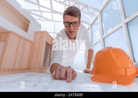 experienced architect doing calculations for new project Stock Photo