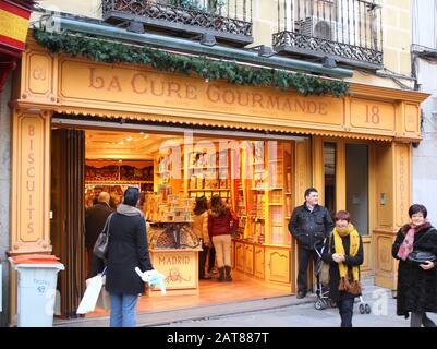 MADRID, SPAIN - DECEMBER 1 : People buy in La Cure Gourmande store on December 1, 2012 in Madrid Spain. La Cure Gourmande is a French confectionery bu Stock Photo