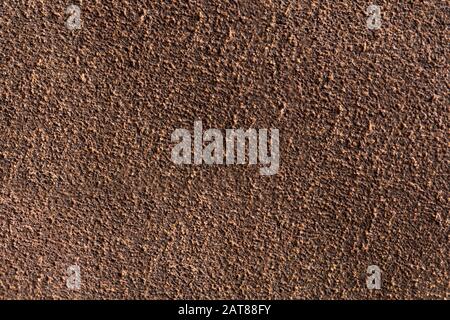 Background macro texture of suede brown leather. Stock Photo