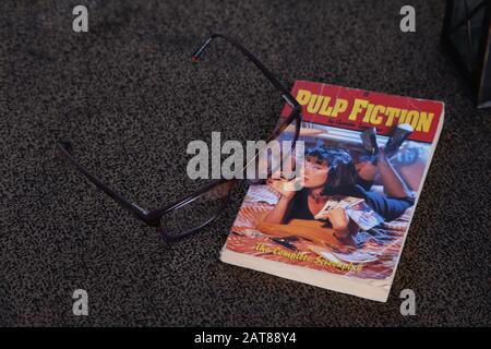 Pulp Fiction the Complete Screenplay crime noir paperback book, Instagram style with glasses spectacles Stock Photo