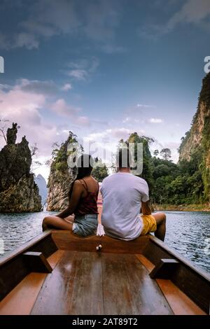 young men and woman couple on vacation in Thailand visiting the national park Khao Sok Jungle Stock Photo