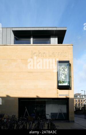 Window housing a mother and child sculpture at the John Lewis shop on Downing street, Cambridge, England. Stock Photo
