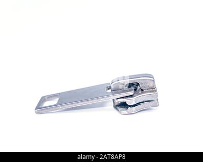 Zipper slider on a white background. Place for text. Free place. Macro photo. Stock Photo
