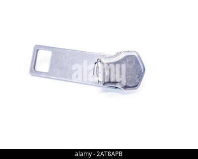 Zipper slider on a white background. Place for text. Free place. Macro photo. Stock Photo