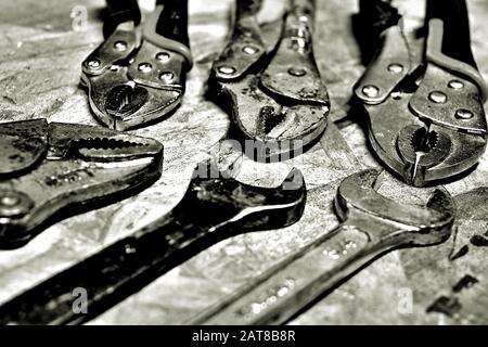 GLENDALE, UNITED STATES - Dec 04, 2019: A set of vise grips and wrenches in black and white. Stock Photo