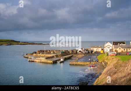 The bay and harbour at Portballintrae a small seaside village in County Antrim, Northern Ireland Stock Photo