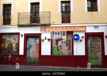 Murals on the shutters of a bar in the Alfalfa district, Seville, Spain Stock Photo