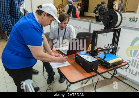 The participant receives task for 3D printer Stock Photo