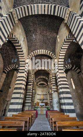Central nave of San Pietro di Sorres Basilica, Benedictine monastery, 12-13th century, in village of Borutta, Sassari province, Sardinia, Italy Stock Photo