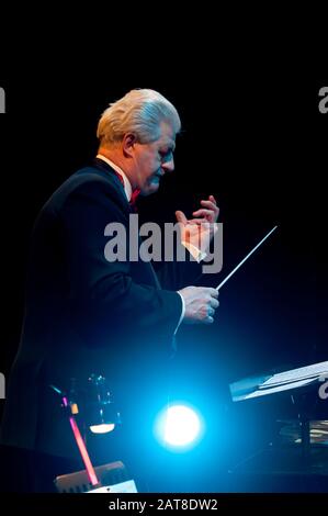 Conductor directing orchestra Stock Photo