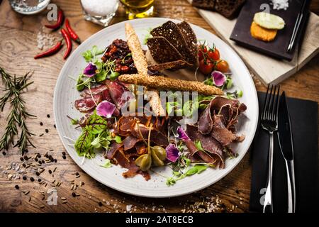 Meat platter for two served on a plate in restaurant Stock Photo