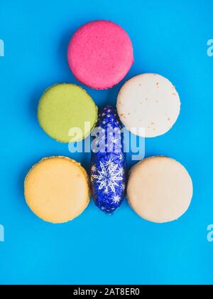Closeup assortment of lots of multicolored tasty macarons, Christmas tree shape made of tasty macarons