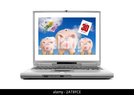 laptop displaying three piggybanks on Euro coins, composing with banknotes and calendar sheet dated 30.10., World Savings Day Stock Photo